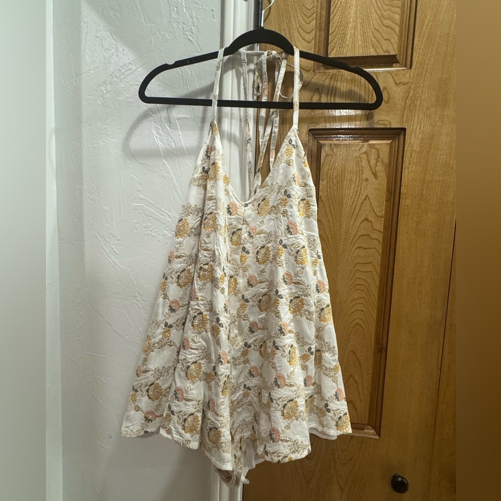 Free People Floral Print Halter romper in Cream and Gold. NWOT. Size XS.